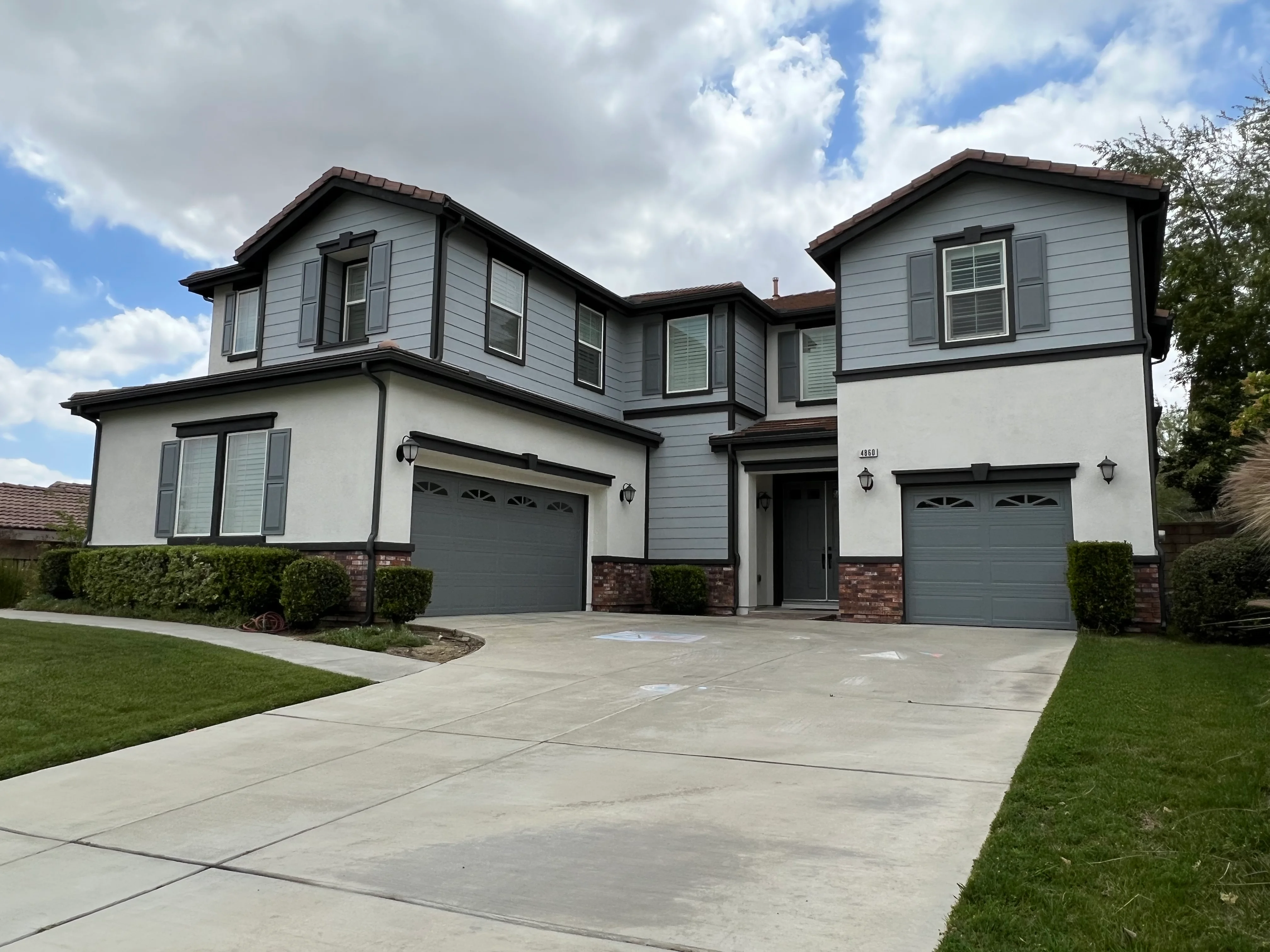Modern Home Exterior with Gutter Installation